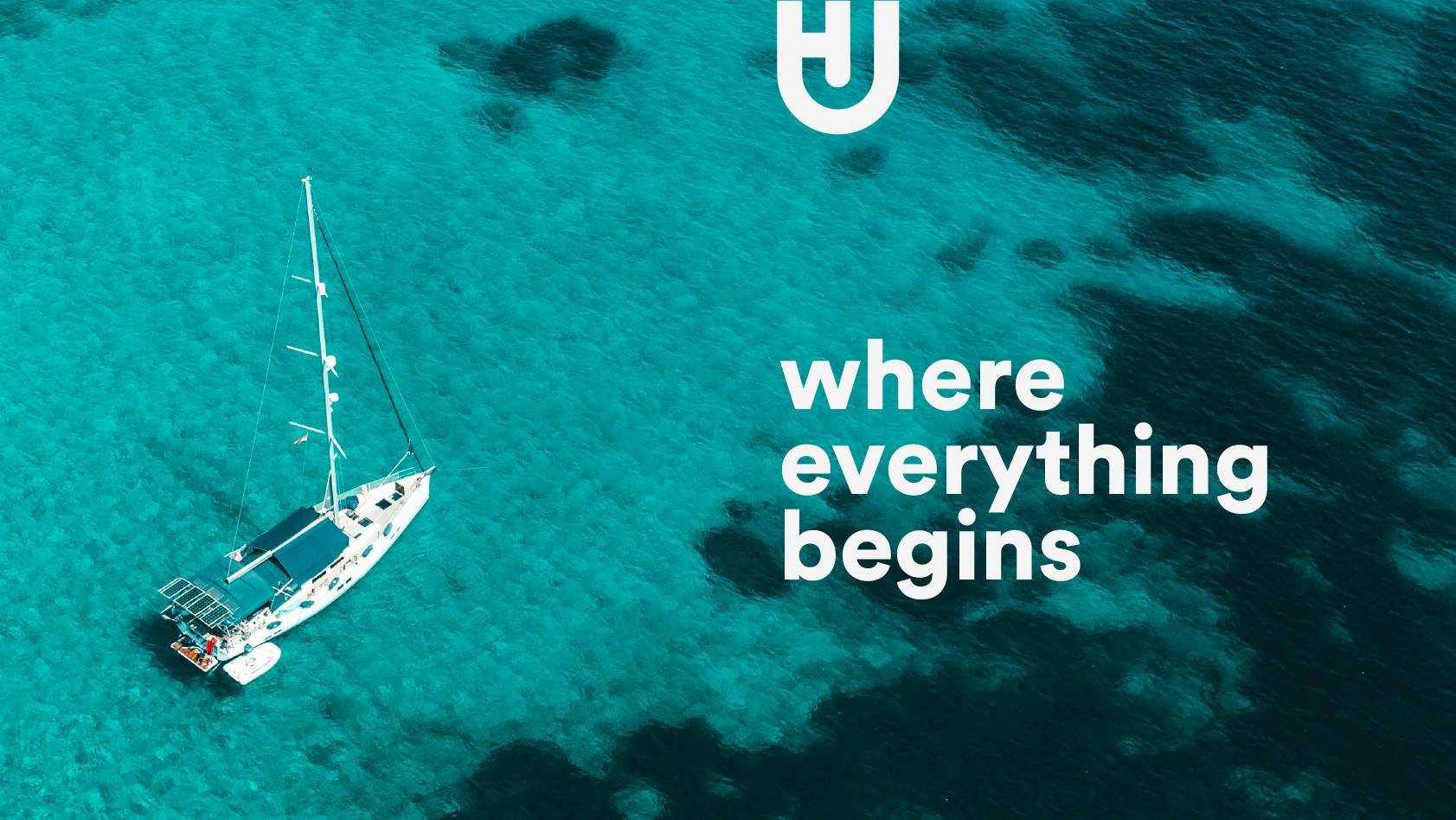 House of Journeys — where everything begins, aerial shot of a sailboat